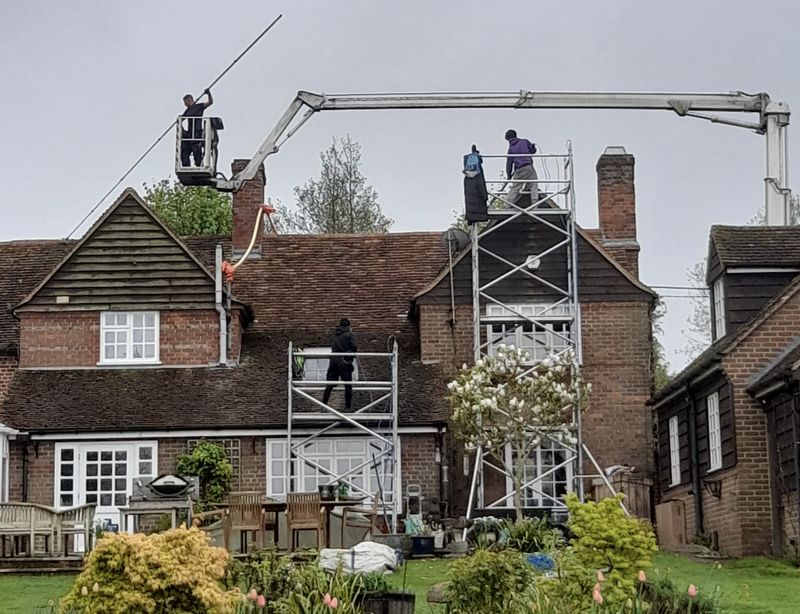 The Moss Cleaners using cherry picker and scaffolding to clean roof safely and professionally in Polesworth, Warwickshire